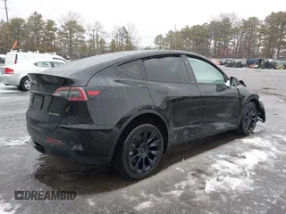 2023 Tesla Model Y Long Range with VIN 7SAYGDEE8PA183301, listed as a IAAI auction lot 41498769 with 82,893 mi miles and . Bid and sale history available at carsss.com. Image 4.