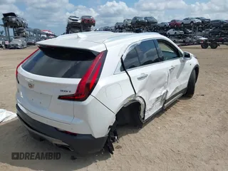 2019 Cadillac XT4 AWD Premium Luxury z VIN 1GYFZDR48KF131619, wystawiony jako IAAI lot #42202281 z przebiegiem 67 048 mil mil oraz . Historia ofert i sprzedaży dostępna na DreamBid. Obrazek 4.