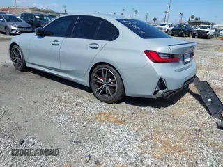 2024 BMW 3 Series 330i with VIN 3MW69FF04R8E41348, listed as a IAAI auction lot 42020955 with 23,395 mi miles. Bid and sale history available at carsss.com. Image 3.
