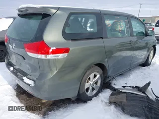 2014 Toyota Sienna L with VIN 5TDZK3DC2ES429684, listed as a IAAI auction lot 41529309 with 112,190 mi miles. Bid and sale history available at carsss.com. Image 4.