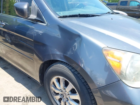 2010 Honda Odyssey EX-L z VIN 5FNRL3H76AB071871, wystawiony jako IAAI lot #42214867 z przebiegiem 255 116 mil mil oraz . Historia ofert i sprzedaży dostępna na DreamBid. Obrazek 6.