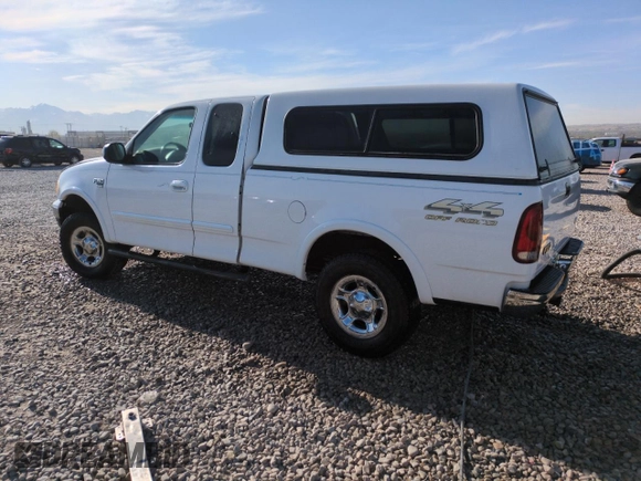 1999 Ford F-150 XL with VIN 1FTRX18L2XKA97143, listed as a Copart auction lot 52973695 with 115,180 mi miles and Salvage Title. Bid and sale history available at carsss.com. Image 2.