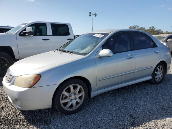 2006 Kia Spectra EX with VIN KNAFE121365229594, listed as a Copart auction lot 77311084 with 129,789 mi miles and Salvage Title. Bid and sale history available at carsss.com. Image 1.