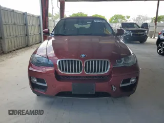 2014 BMW X6 50i z VIN 5UXFG8C58EL592408, wystawiony jako Copart lot #58175225 z przebiegiem 119 939 mil mil oraz Czysty tytuł • Clean title. Historia ofert i sprzedaży dostępna na DreamBid. Obrazek 5.