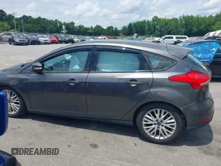 2016 Ford Focus Titanium with VIN 1FADP3N20GL275763, listed as a IAAI auction lot 42511959 with 124,891 mi miles and . Bid and sale history available at DreamBid. Image 14.