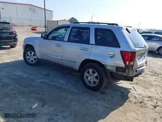 2010 Jeep Grand Cherokee Laredo with VIN 1J4PS4GK2AC155683, listed as a IAAI auction lot 41411133 with 211,803 mi miles. Bid and sale history available at carsss.com. Image 3.