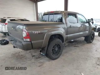 2013 Toyota Tacoma z VIN 3TMLU4EN9DM124980, wystawiony jako IAAI lot #41576747 z przebiegiem 209 883 mil mil oraz . Historia ofert i sprzedaży dostępna na DreamBid. Obrazek 4.