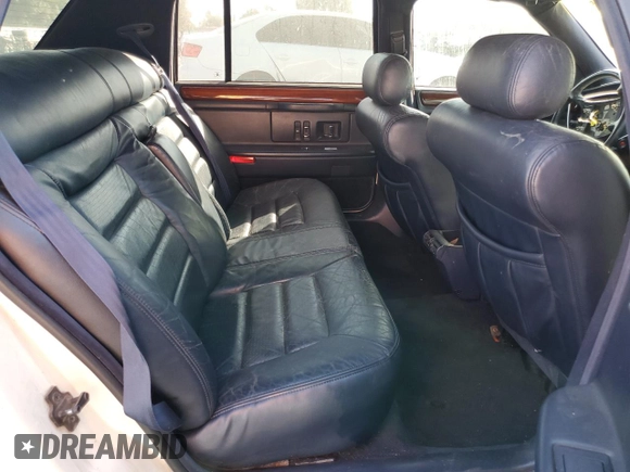 1995 Cadillac Concours z VIN 1G6KF52Y0SU301356, wystawiony jako Copart lot #77372694 z przebiegiem 132 934 mil mil oraz Szkody całkowita. Historia ofert i sprzedaży dostępna na DreamBid. Obrazek 10.