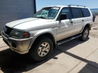 2002 Mitsubishi Montero XLS z VIN JA4MT31R42J048762, wystawiony jako Copart lot #54794835 z przebiegiem 124 978 mil mil oraz Czysty tytuł • Clean title. Historia ofert i sprzedaży dostępna na DreamBid. Obrazek 1.
