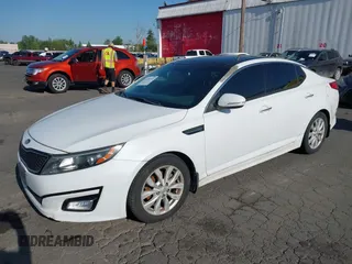 2014 Kia Optima EX with VIN 5XXGN4A73EG314797, listed as a IAAI auction lot 42136952 with 71,310 mi miles and . Bid and sale history available at carsss.com. Image 2.