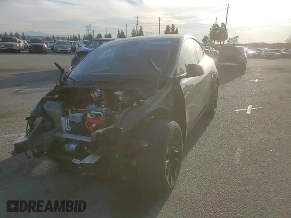 2024 Tesla Model Y with VIN 7SAYGDED7RF056973, listed as a Copart auction lot 87139214 with 15,391 mi miles and Salvage Title. Bid and sale history available at DreamBid. Image 11.