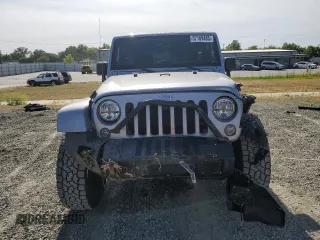 2014 Jeep Wrangler Unlimited Sahara with VIN 1C4HJWEG1EL126611, listed as a Copart auction lot 57169485 with 122,000 mi miles and Salvage title. Bid and sale history available at DreamBid. Image 5.