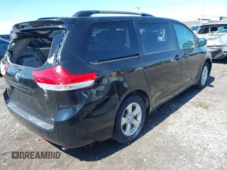 2014 Toyota Sienna LE AAS with VIN 5TDKK3DC4ES445998, listed as a IAAI auction lot 42093872 with 220,943 mi miles. Bid and sale history available at carsss.com. Image 4.