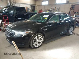 2015 Ford Taurus Limited with VIN 1FAHP2J87FG172580, listed as a IAAI auction lot 41891567 with 183,784 mi miles. Bid and sale history available at carsss.com. Image 2.