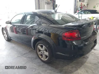 2014 Dodge Avenger SE with VIN 1C3CDZAB0EN202602, listed as a IAAI auction lot 42133657 with 130,741 mi miles. Bid and sale history available at carsss.com. Image 3.
