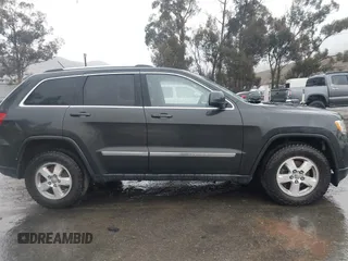 2011 Jeep Grand Cherokee Laredo z VIN 1J4RR4GG1BC566381, wystawiony jako IAAI lot #41547199 z przebiegiem 215 157 mil mil oraz . Historia ofert i sprzedaży dostępna na DreamBid. Obrazek 13.