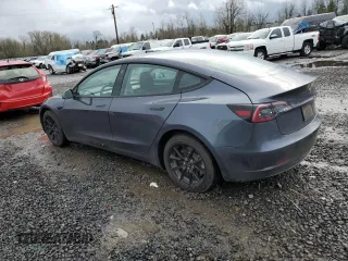 2023 Tesla Model 3 Long Range with VIN 5YJ3E1EB6PF686927, listed as a Copart auction lot 45602285 with 46,534 mi miles and Salvage Title. Bid and sale history available at DreamBid. Image 2.