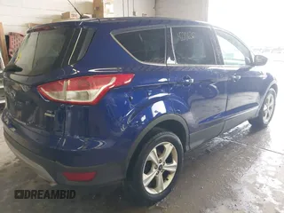 2016 Ford Escape SE with VIN 1FMCU9GX2GUA80134, listed as a IAAI auction lot 42206351 with 129,885 mi miles and . Bid and sale history available at DreamBid. Image 4.
