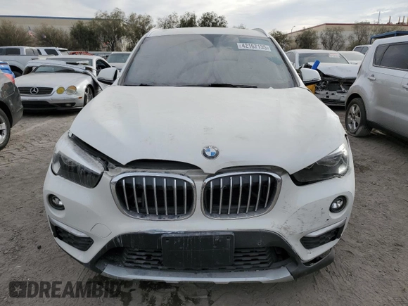 2018 BMW X1 sDrive28i with VIN WBXHU7C37J5H44386, listed as a Copart auction lot 42167135 with 96,668 mi miles and Salvage Title. Bid and sale history available at DreamBid. Image 5.