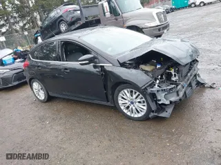 2015 Ford Focus Titanium with VIN 1FADP3N2XFL300859, listed as a IAAI auction lot 41944410 with 76,194 mi miles. Bid and sale history available at carsss.com. Image 1.