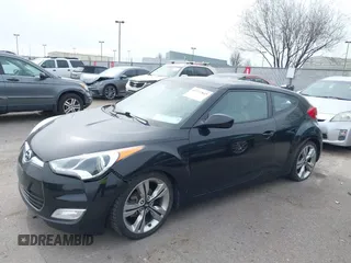 2013 Hyundai Veloster w/Black Int with VIN KMHTC6AD8DU155575, listed as a IAAI auction lot 41722849 with 100,204 mi miles and . Bid and sale history available at DreamBid. Image 2.