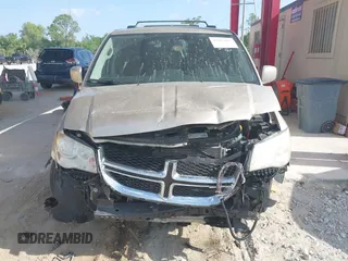 2014 Dodge Grand Caravan SXT with VIN 2C4RDGCG8ER244201, listed as a IAAI auction lot 42017091 with 161,653 mi miles and . Bid and sale history available at DreamBid. Image 13.