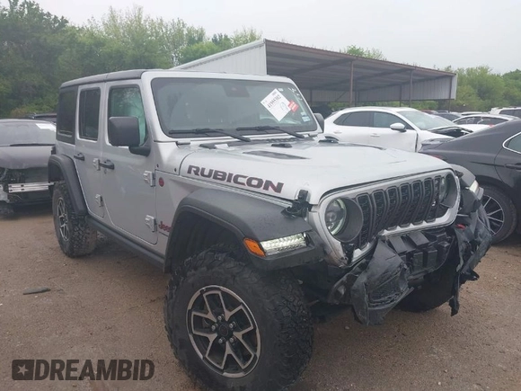 2024 Jeep Wrangler Rubicon with VIN 1C4PJXFG7RW252959, listed as a IAAI auction lot 41955302 with 27,727 mi miles and . Bid and sale history available at DreamBid. Image 1.