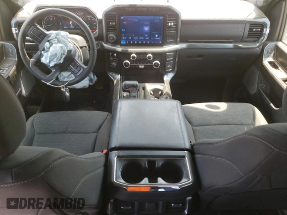 2023 Ford F-150 XL with VIN 1FTFW1E8XPKE23518, listed as a Copart auction lot 60340975 with 11,661 mi miles and Salvage title. Bid and sale history available at DreamBid. Image 8.