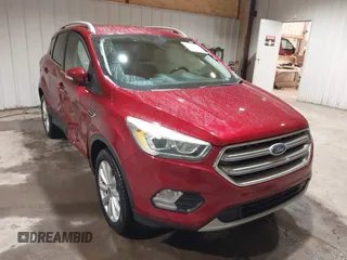 2017 Ford Escape Titanium z VIN 1FMCU9J9XHUC20359, wystawiony jako IAAI lot #41938688 z przebiegiem 79 743 mil mil oraz . Historia ofert i sprzedaży dostępna na DreamBid. Obrazek 1.