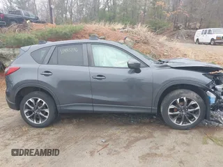2016 Mazda CX-5 Grand Touring with VIN JM3KE4DY1G0743897, listed as a IAAI auction lot 41935796 with 167,150 mi miles and . Bid and sale history available at carsss.com. Image 14.