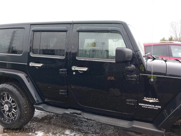 2011 Jeep Wrangler Unlimited Sahara with VIN 1J4BA5H12BL548870, listed as a IAAI auction lot 42010303 with 139,693 mi miles. Bid and sale history available at carsss.com. Image 13.