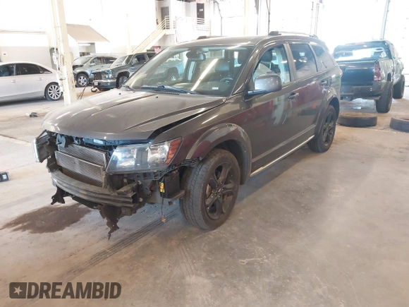 2019 Dodge Journey Crossroad z VIN 3C4PDCGG9KT717767, wystawiony jako IAAI lot #42179967 z przebiegiem 98 686 mil mil oraz . Historia ofert i sprzedaży dostępna na DreamBid. Obrazek 2.