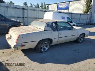 1984 Oldsmobile Cutlass Supreme z VIN 1G3AR47A5EM432583, wystawiony jako Copart lot #82311834 z przebiegiem 39 640 mil mil oraz Czysty tytuł • Clean title. Historia ofert i sprzedaży dostępna na DreamBid. Obrazek 3.