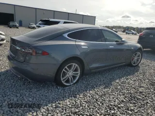 2014 Tesla Model S 60 with VIN 5YJSA1H1XEFP32590, listed as a Copart auction lot 64424145 with Not provided miles and Clean title. Bid and sale history available at DreamBid. Image 3.