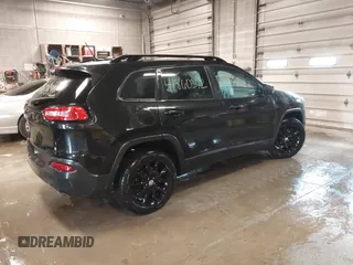 2014 Jeep Cherokee Latitude with VIN 1C4PJMCS0EW291135, listed as a IAAI auction lot 41860372 with 171,524 mi miles and . Bid and sale history available at DreamBid. Image 4.