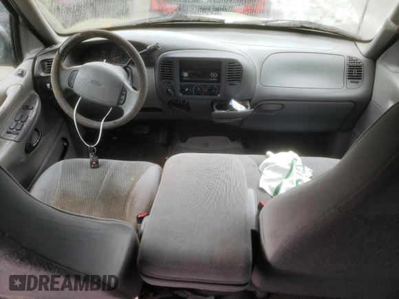 1997 Ford Expedition XLT z VIN 1FMEU17L6VLA61113, wystawiony jako Copart lot #73465703 z przebiegiem 184 878 mil mil oraz Czysty tytuł • Clean title. Historia ofert i sprzedaży dostępna na DreamBid. Obrazek 8.