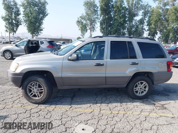 2004 Jeep Grand Cherokee Laredo with VIN 1J4GX48N24C334983, listed as a IAAI auction lot 42522088 with 169,793 mi miles and . Bid and sale history available at DreamBid. Image 14.