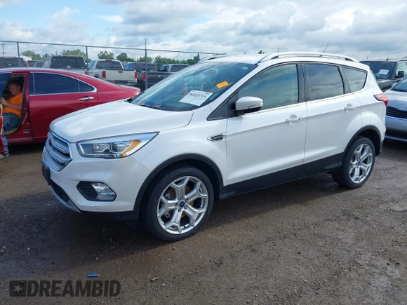 2019 Ford Escape Titanium with VIN 1FMCU9J98KUA95238, listed as a IAAI auction lot 42525324 with 59,222 mi miles and . Bid and sale history available at DreamBid. Image 17.