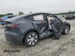 2024 Tesla Model Y Long Range with VIN 7SAYGAEE7RF005786, listed as a Copart auction lot 58415195 with 8,700 mi miles and Salvage title. Bid and sale history available at DreamBid. Image 3.