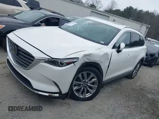 2016 Mazda CX-9 Grand Touring with VIN JM3TCADY0G0113779, listed as a IAAI auction lot 41466750 with 58,035 mi miles and . Bid and sale history available at DreamBid. Image 17.