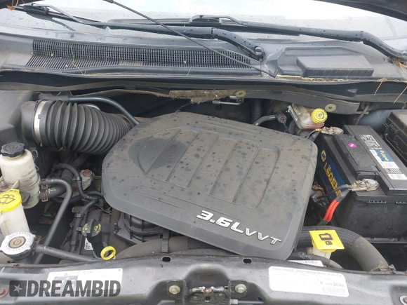 2013 Dodge Grand Caravan SXT with VIN 2C4RDGCG4DR636798, listed as a IAAI auction lot 42240550 with 96,100 mi miles and . Bid and sale history available at DreamBid. Image 10.
