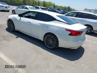 2016 Nissan Maxima SV with VIN 1N4AA6AP6GC903638, listed as a IAAI auction lot 42180421 with 124,586 mi miles and . Bid and sale history available at DreamBid. Image 3.