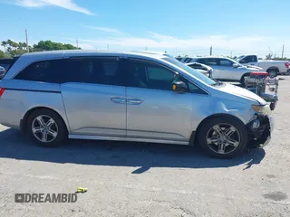 2012 Honda Odyssey Touring with VIN 5FNRL5H90CB099519, listed as a IAAI auction lot 41854550 with 185,110 mi miles. Bid and sale history available at carsss.com. Image 14.