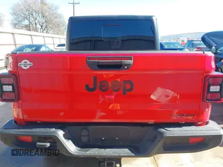 2021 Jeep Gladiator Freedom z VIN 1C6HJTAG7ML609661, wystawiony jako IAAI lot #41410756 z przebiegiem 44 636 mil mil oraz . Historia ofert i sprzedaży dostępna na DreamBid. Obrazek 16.