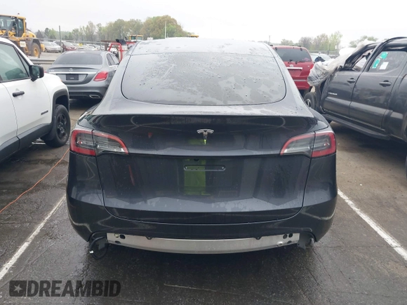 2025 Tesla Model Y Long Range with VIN 7SAYGDED8SA340082, listed as a IAAI auction lot 41915369 with 7,296 mi miles and . Bid and sale history available at DreamBid. Image 17.