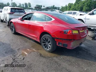 2020 Tesla Model S Long Range with VIN 5YJSA1E25LF396213, listed as a IAAI auction lot 42383231 with 73,125 mi miles and . Bid and sale history available at DreamBid. Image 3.