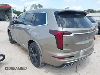 2022 Cadillac XT6 Premium Luxury z VIN 1GYKPCRS4NZ107852, wystawiony jako IAAI lot #42075012 z przebiegiem 66 046 mil mil oraz . Historia ofert i sprzedaży dostępna na DreamBid. Obrazek 3.
