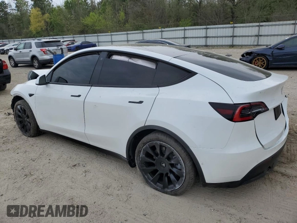 2021 Tesla Model Y Standard Range z VIN 5YJYGDED1MF109091, wystawiony jako Copart lot #50414004 z przebiegiem Nie podano mil oraz Szkody całkowita. Historia ofert i sprzedaży dostępna na DreamBid. Obrazek 2.