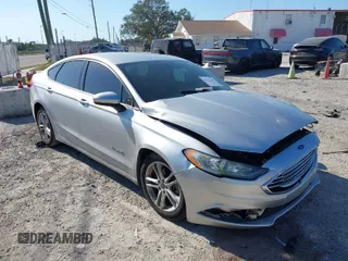 2018 Ford Fusion SE z VIN 3FA6P0LU6JR128030, wystawiony jako IAAI lot #41526411 z przebiegiem 165 947 mil mil oraz . Historia ofert i sprzedaży dostępna na DreamBid. Obrazek 1.