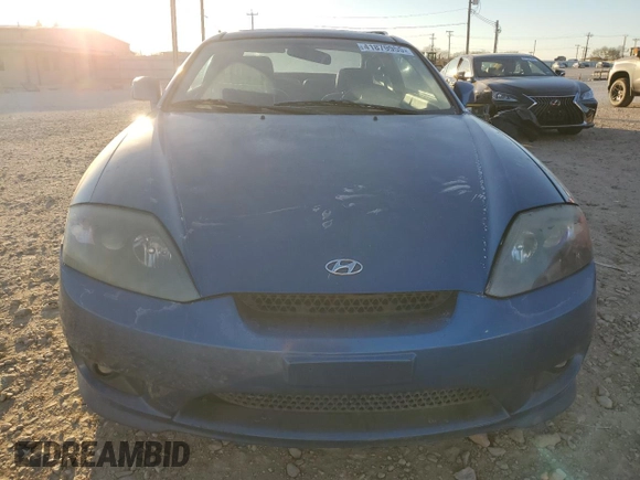 2005 Hyundai Tiburon GT z VIN KMHHN65F35U186438, wystawiony jako Copart lot #41879955 z przebiegiem 152 574 mil mil oraz Szkoda całkowita • Salvage title. Historia ofert i sprzedaży dostępna na DreamBid. Obrazek 5.